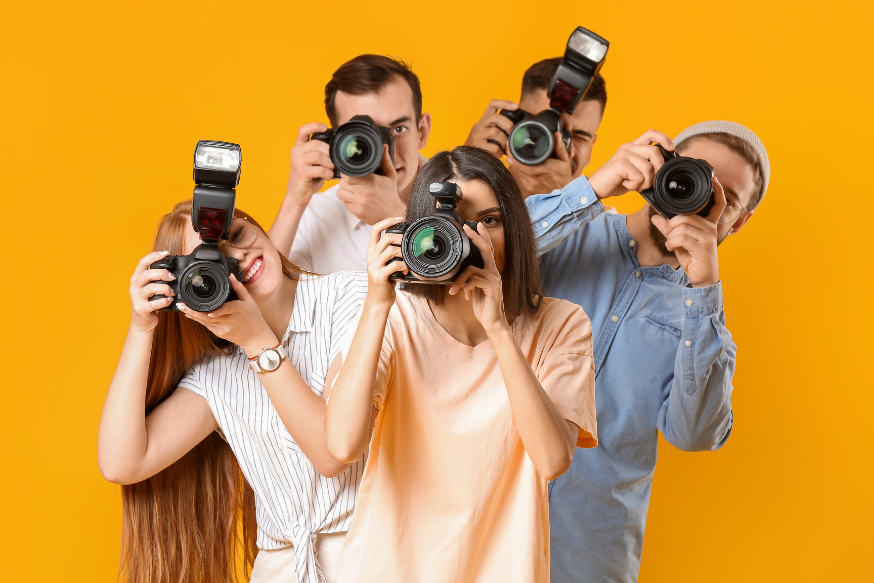 Group of Photographers on Color Background